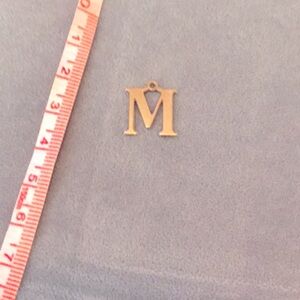 14k gold “M” charm